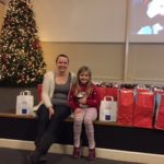 Amy and her daughter volunteer at our Christmas Extravaganza